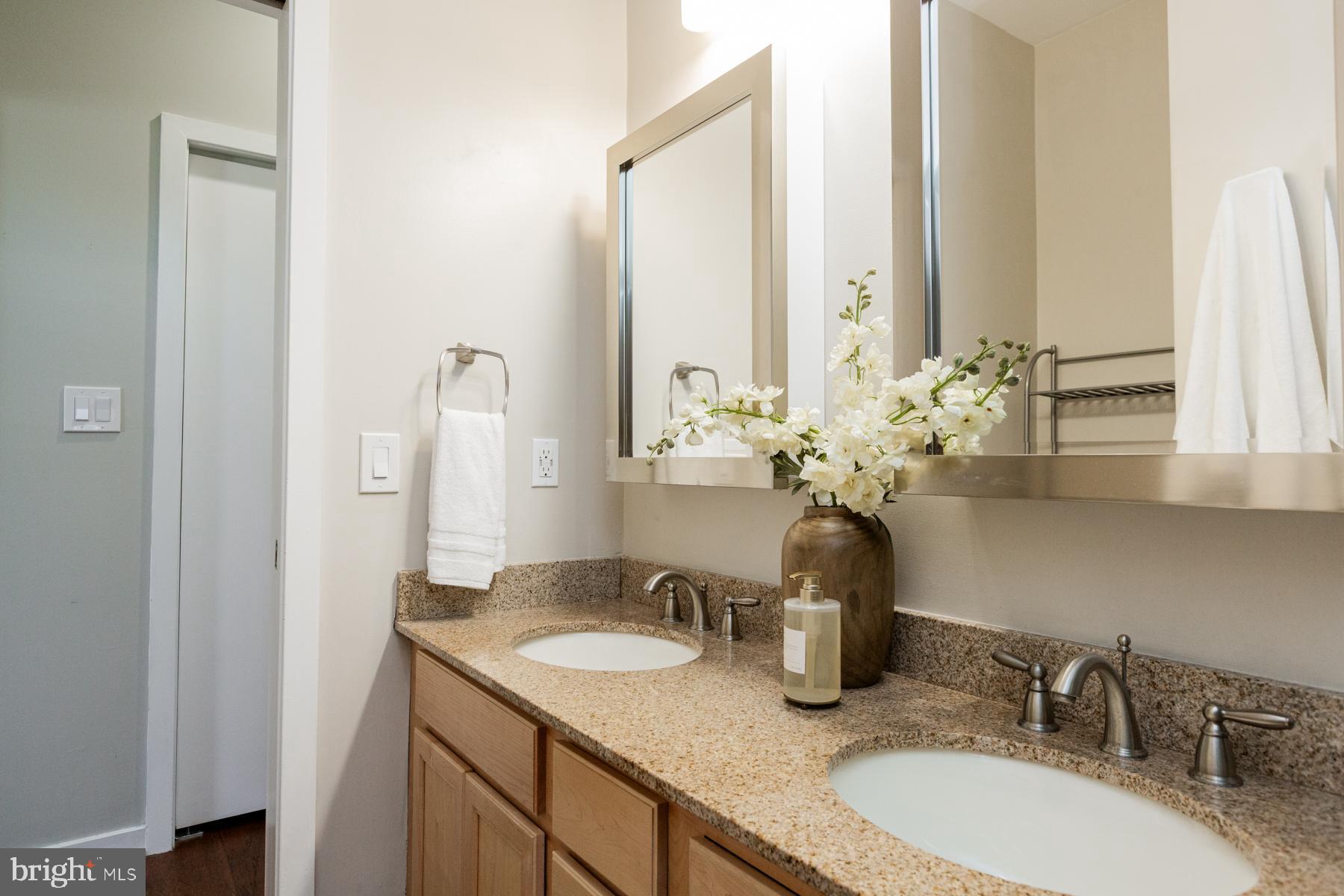 137 South Duke Street Lancaster, PA 17602 - Photo 34 of 51 a bathroom with a granite countertop sink and a mirror