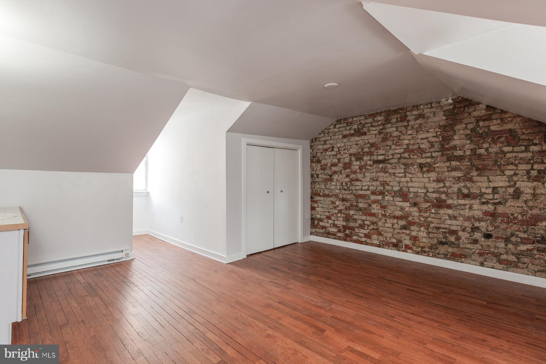 137 South Duke Street Lancaster, PA 17602 - Photo 36 of 51 wooden floor in an empty room with a window