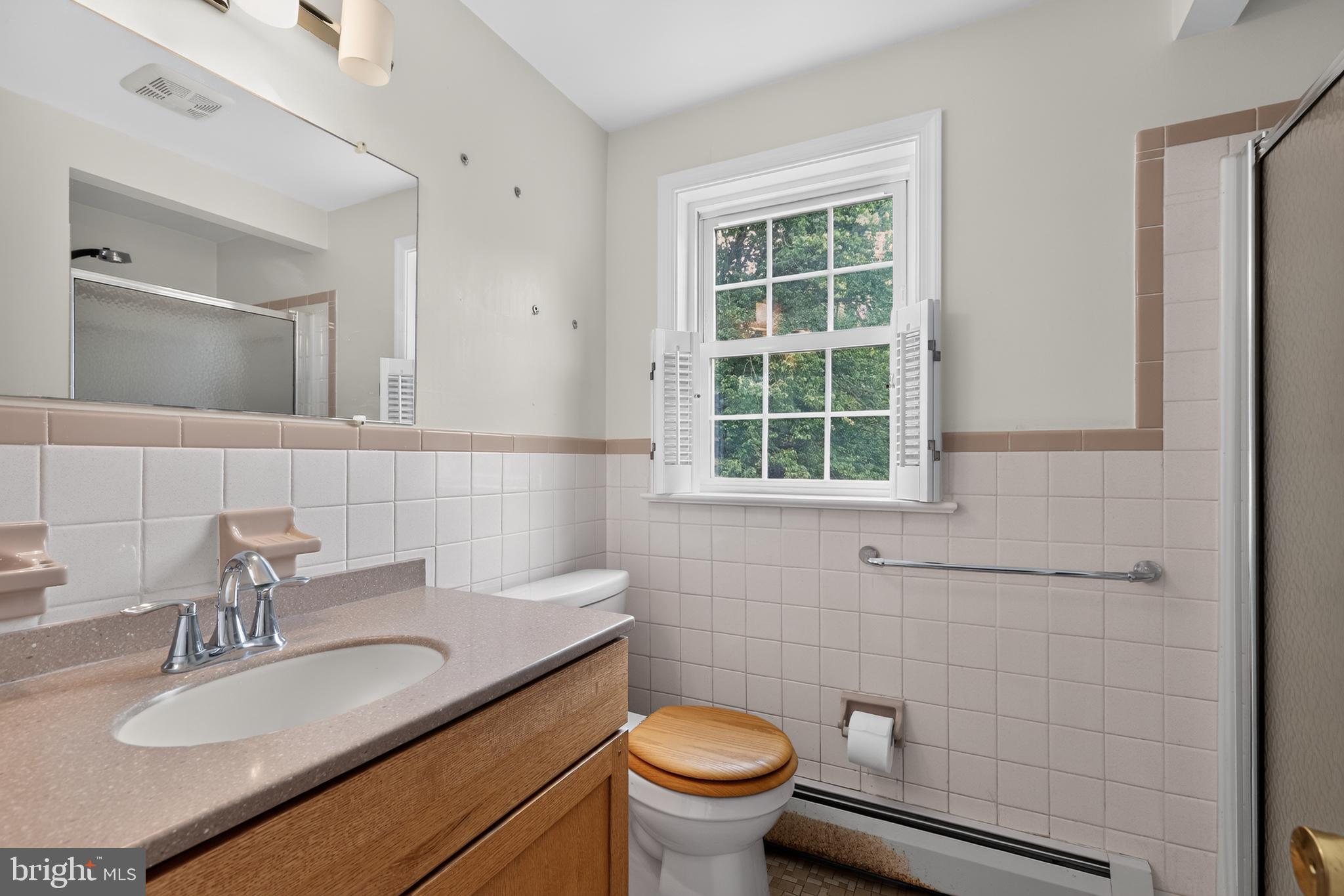 1408 Ponds Edge Road West Chester, PA 19382 - Photo 42 of 53 a bathroom with a granite countertop toilet a sink and a mirror