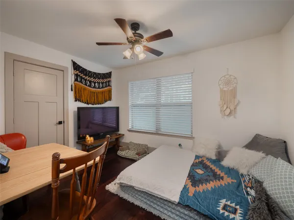 a bed room with a bed and a window