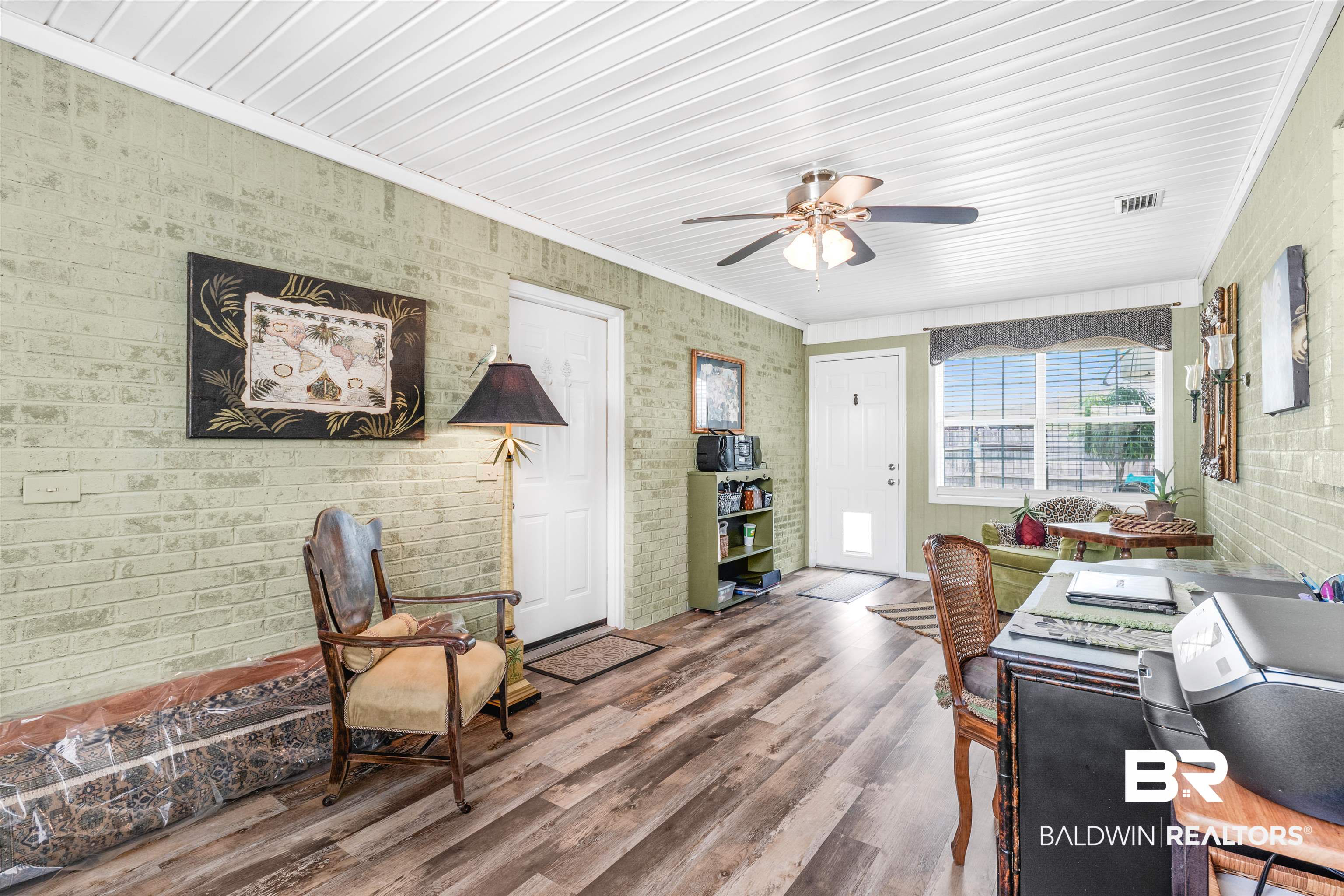 518 Ariel Avenue Foley, AL 36535 - Photo 32 of 47 Interior space with hardwood / wood-style floors, crown molding, ceiling fan, wood ceiling, and brick wall