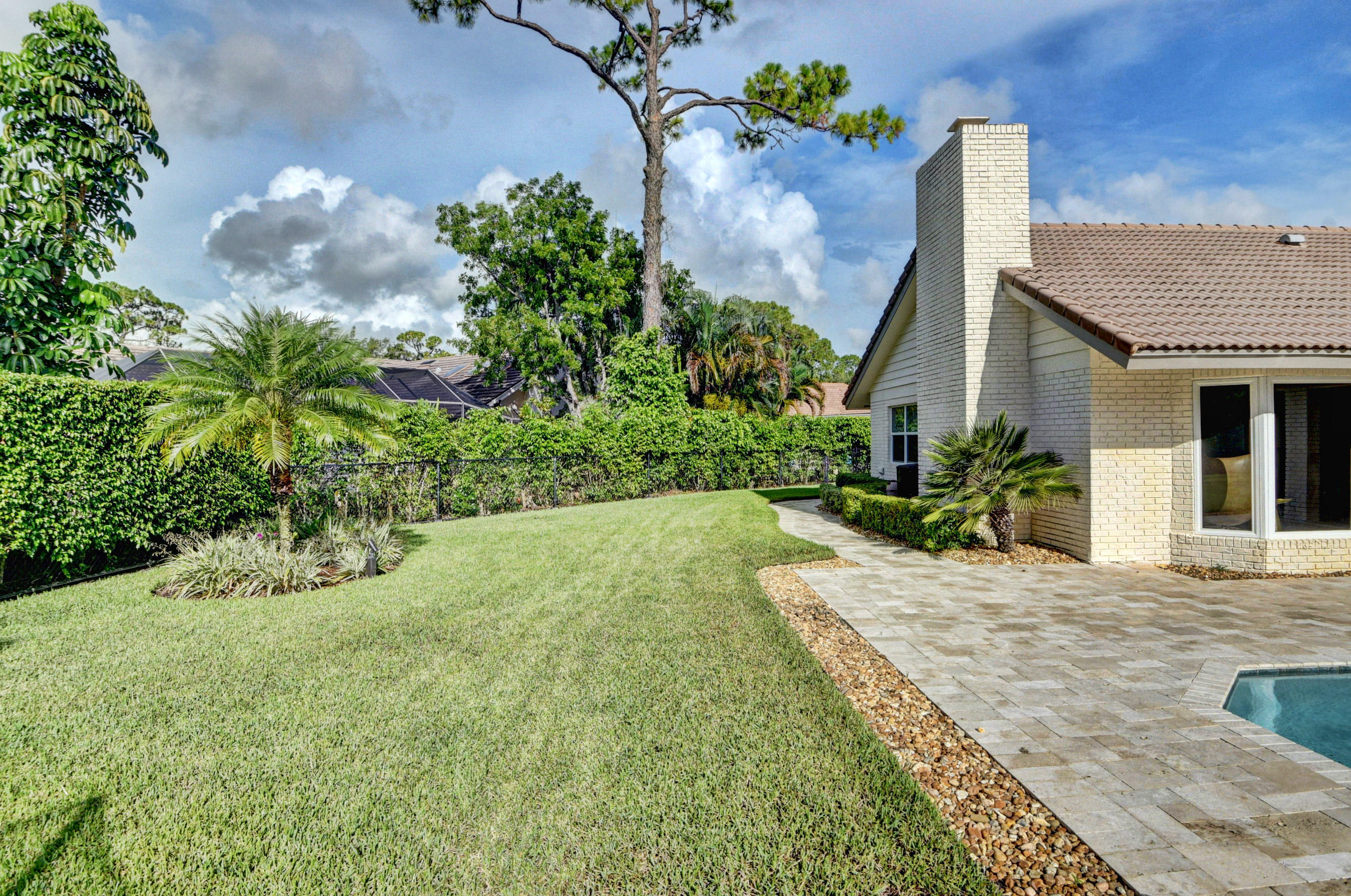 7624 Marbella Terrace Boca Raton, FL 33433 - Photo 41 of 55 a front view of a house with a yard