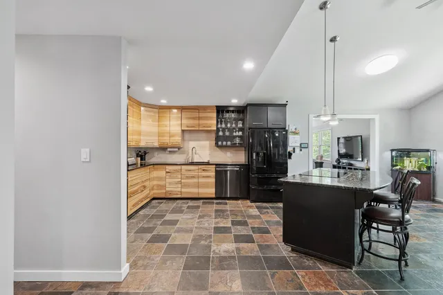 an aerial view of a house with outdoor space