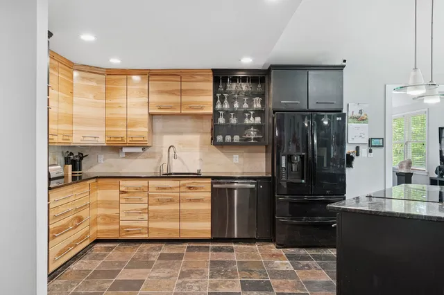 an aerial view of residential house with outdoor space and lake view