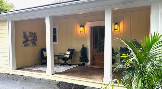a living room with stainless steel appliances kitchen island granite countertop furniture and a kitchen view