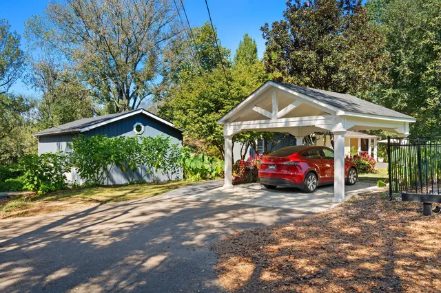 a living room with furniture cabinets and window