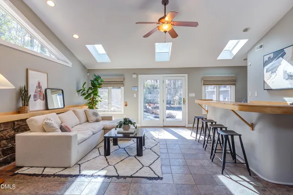 a living room with furniture and a window