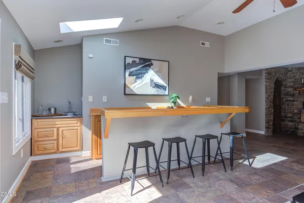 a bathroom with a sink a mirror and a shower