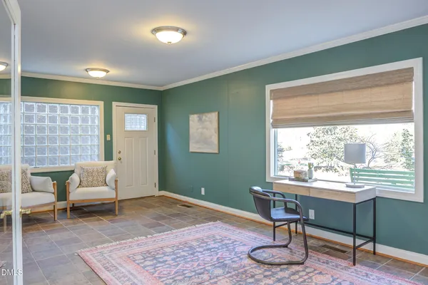 a living room with furniture and window