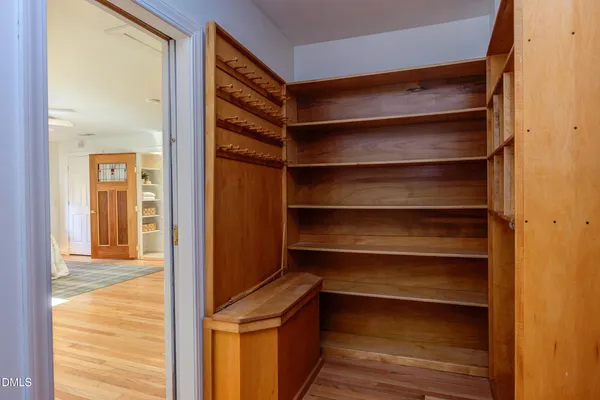 a view of room with window and wooden floor