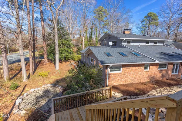 a view of a house with a yard garage and chair
