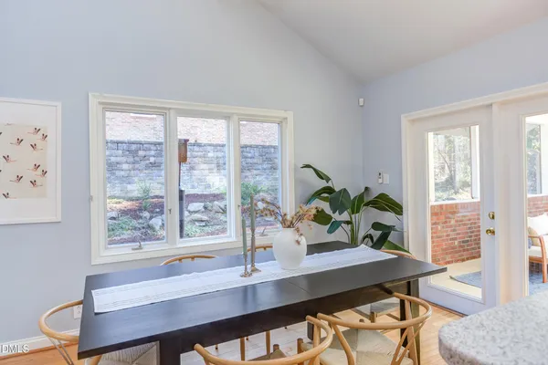 a kitchen with stainless steel appliances sink and large window