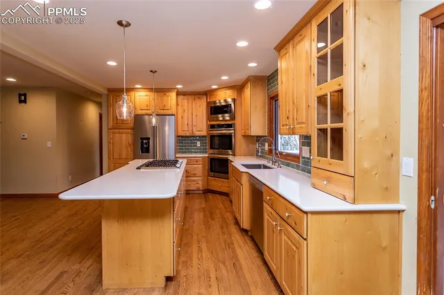 a open kitchen with stainless steel appliances granite countertop a granite counter tops and a view of living room
