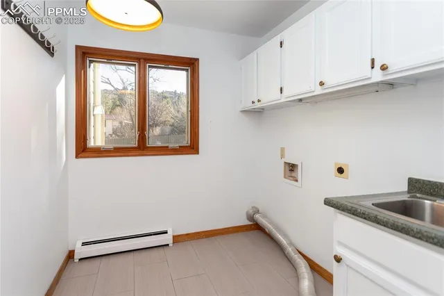 a view of storage and utility room with window