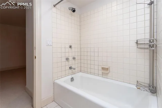 a view of a house with a large tree