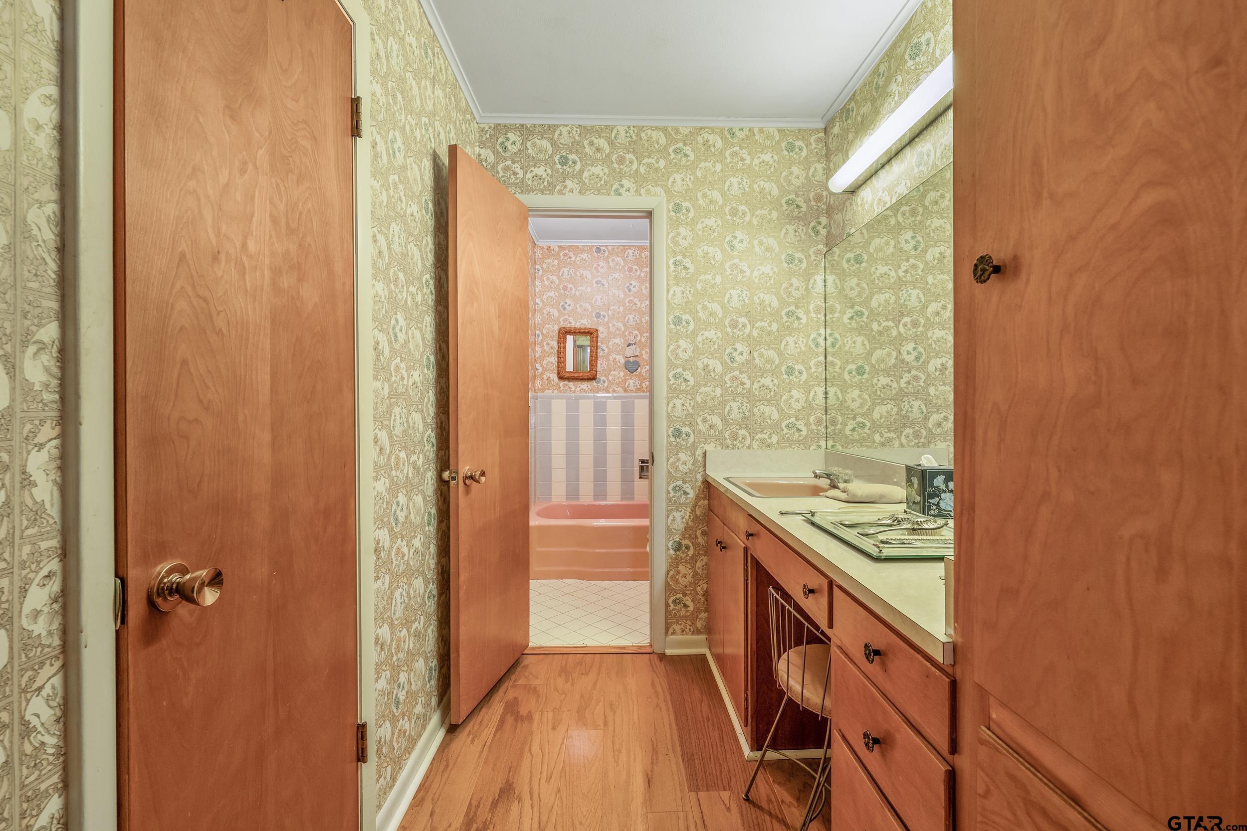 1858 Dickinson Drive Rusk, TX 75785 - Photo 17 of 35 a kitchen with a wooden floor and a stove