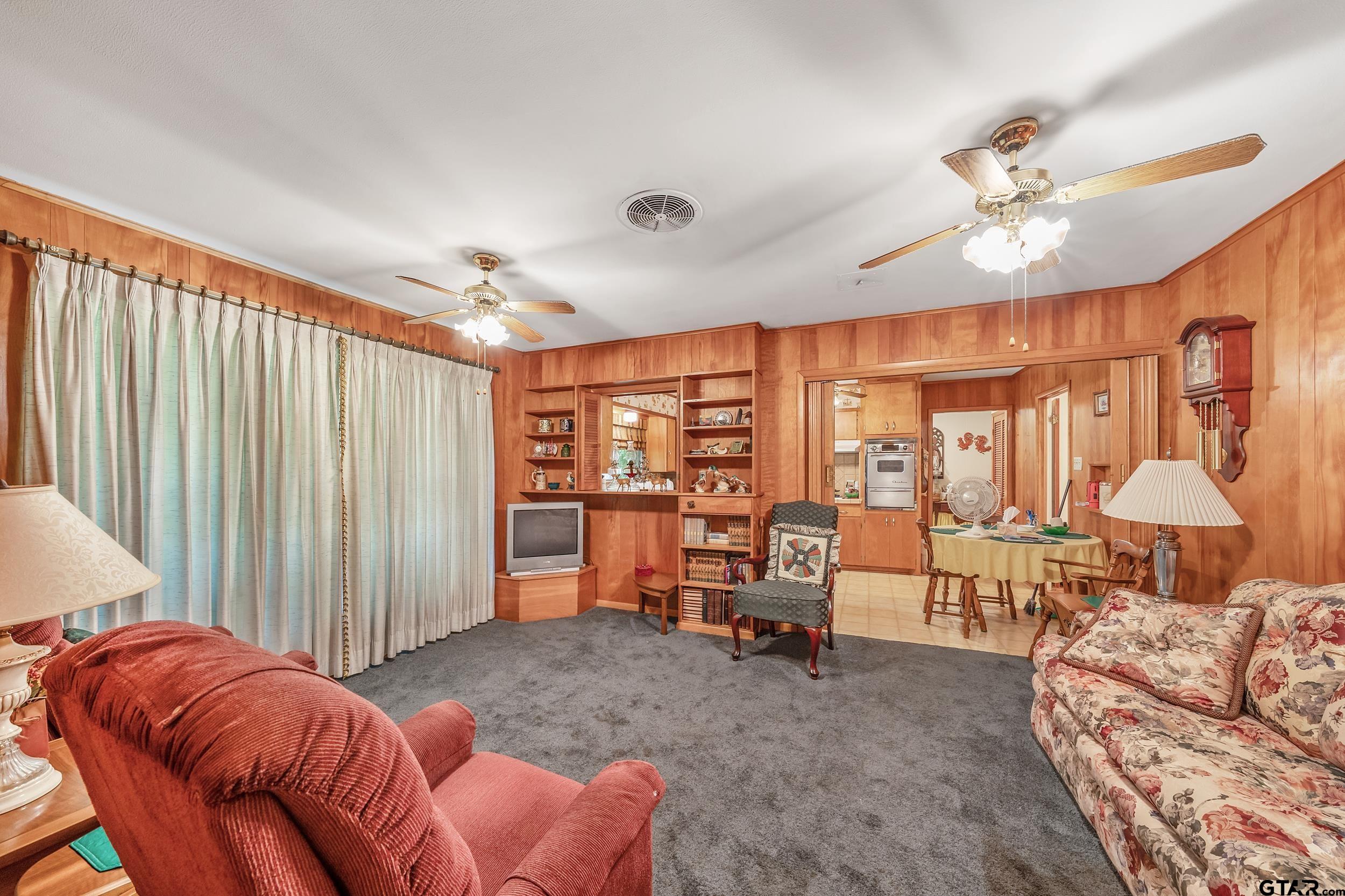 1858 Dickinson Drive Rusk, TX 75785 - Photo 28 of 35 a living room with furniture and a chandelier