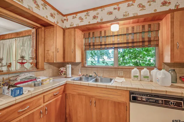 a kitchen with a stove and a refrigerator