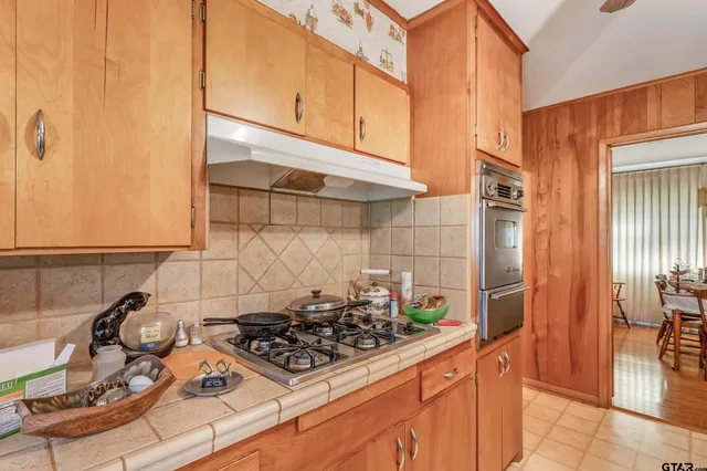 a white refrigerator freezer sitting next to a window