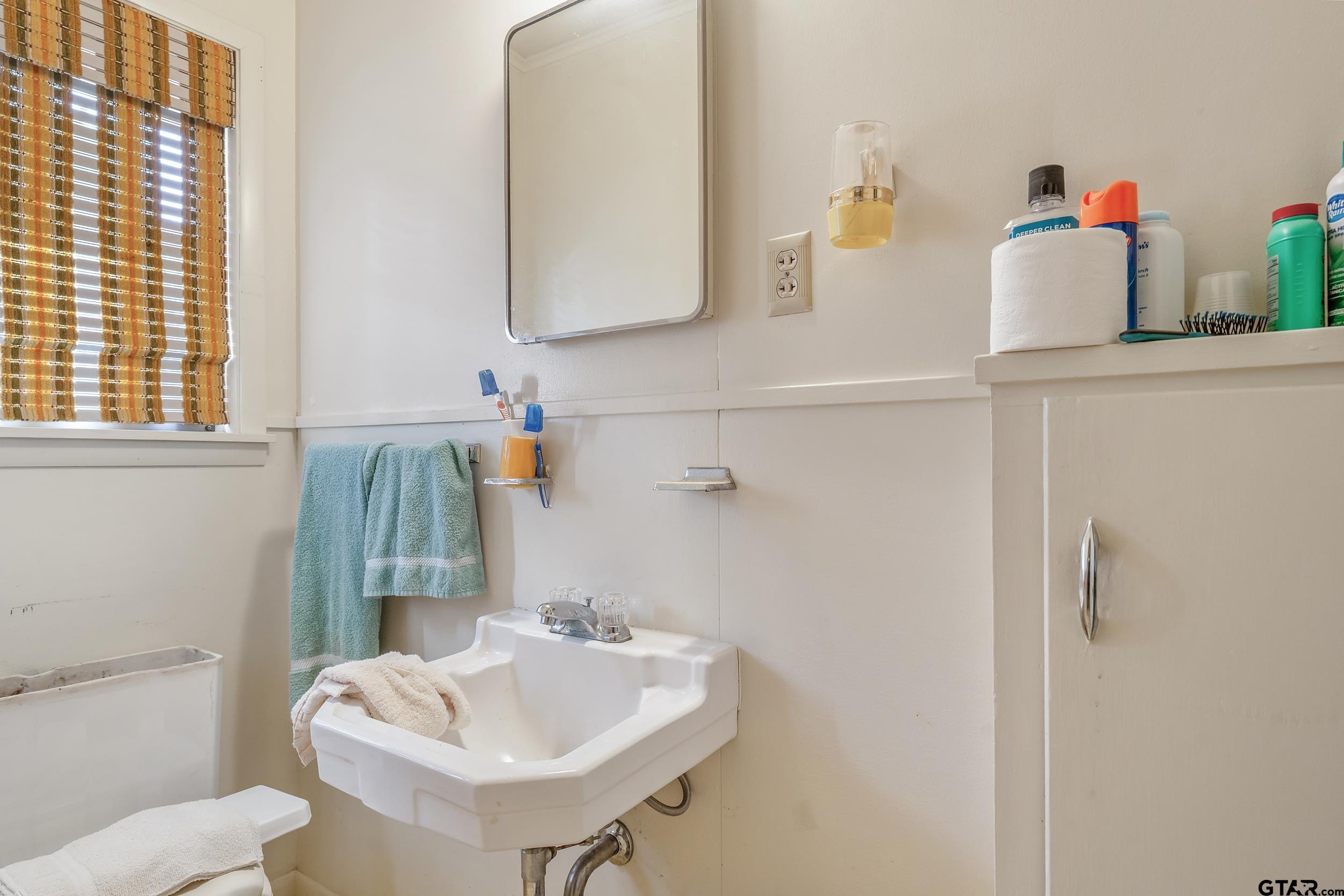 1858 Dickinson Drive Rusk, TX 75785 - Photo 34 of 35 a bathroom with a sink and a toilet