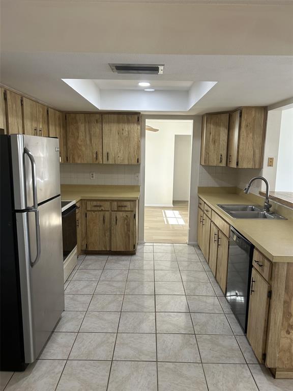 8873 Tami Street Seminole, FL 33772 - Photo 11 of 26 a kitchen with stainless steel appliances granite countertop a refrigerator and a sink