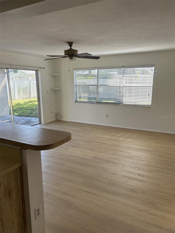 8873 Tami Street Seminole, FL 33772 - Photo 12 of 26 wooden floor in an empty room