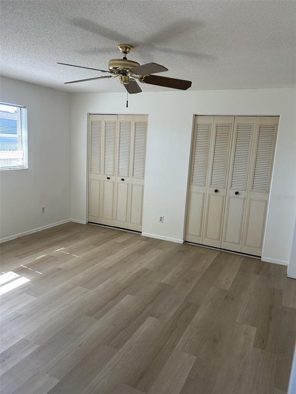 8873 Tami Street Seminole, FL 33772 - Photo 16 of 26 an empty room with a ceiling fan and window