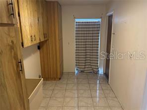 8873 Tami Street Seminole, FL 33772 - Photo 24 of 26 a view of an empty room with stairs