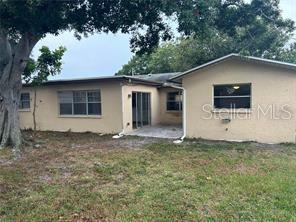 8873 Tami Street Seminole, FL 33772 - Photo 26 of 26 a house with trees in the background