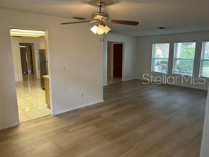 8873 Tami Street Seminole, FL 33772 - Photo 5 of 26 an empty room with windows and entrance