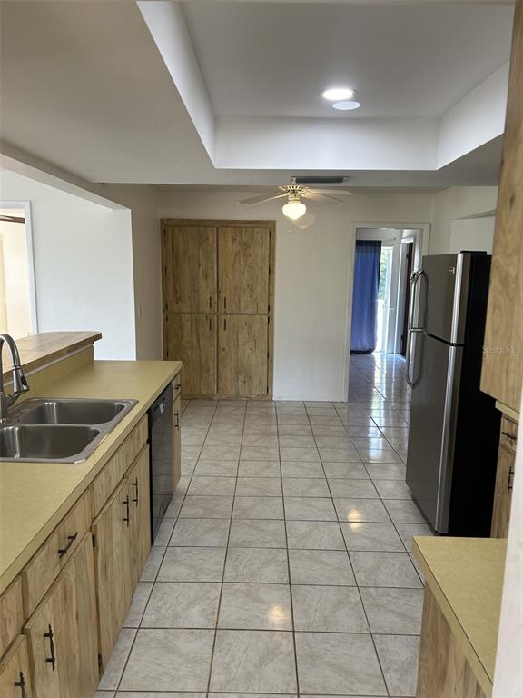 8873 Tami Street Seminole, FL 33772 - Photo 7 of 26 a kitchen with stainless steel appliances granite countertop a refrigerator and a sink