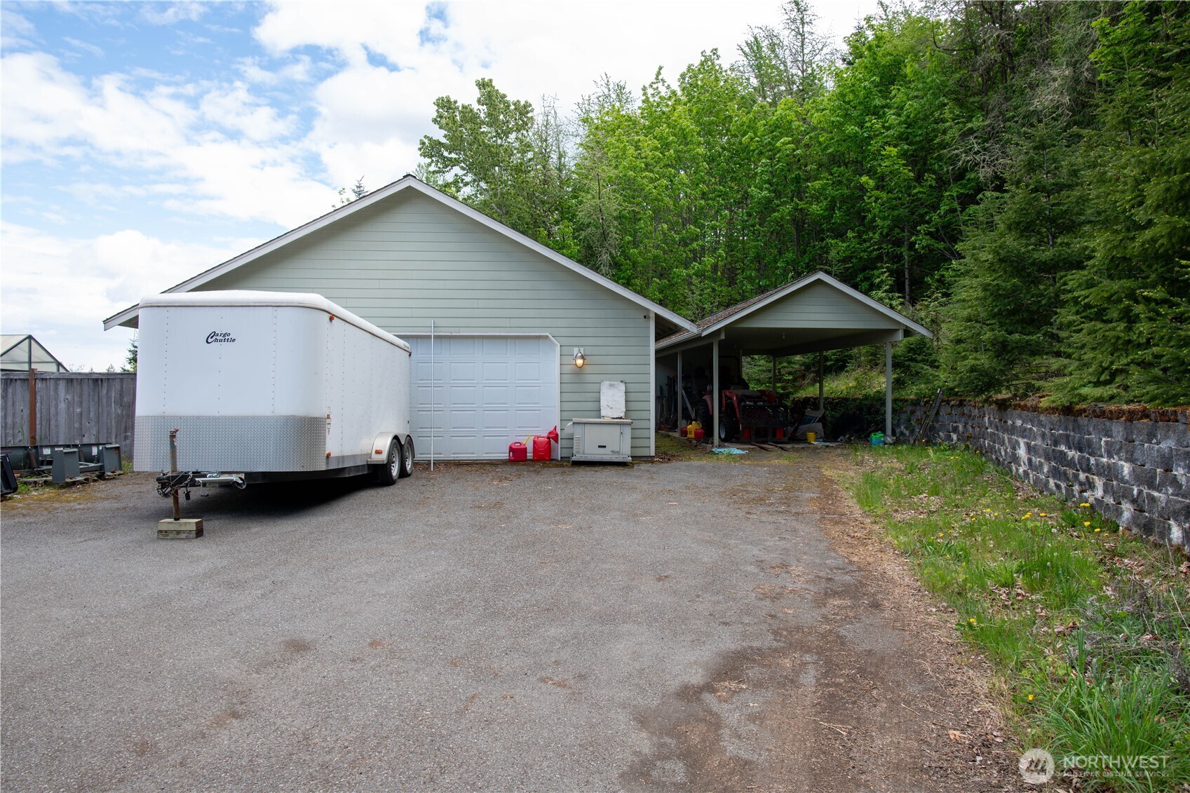 975 Simmons Road Port Angeles, WA 98362 - Photo 37 of 40 a view of a house with backyard and chairs