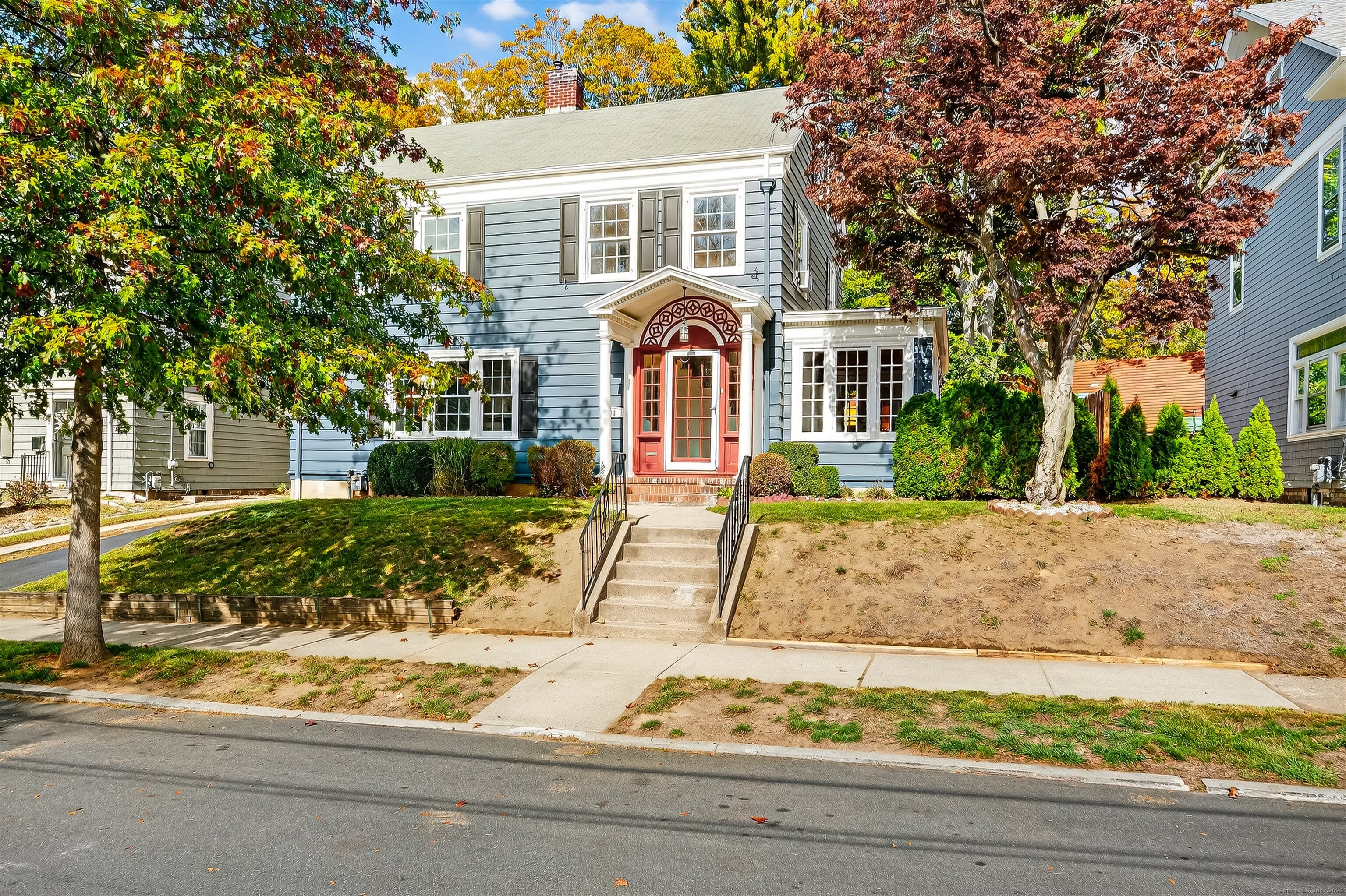 front view of a house with a yard