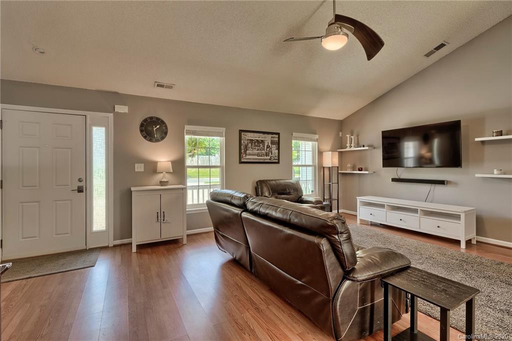 13314 Philip Michael Road Huntersville, NC 28078 - Photo 2 of 39 a living room with furniture and a flat screen tv