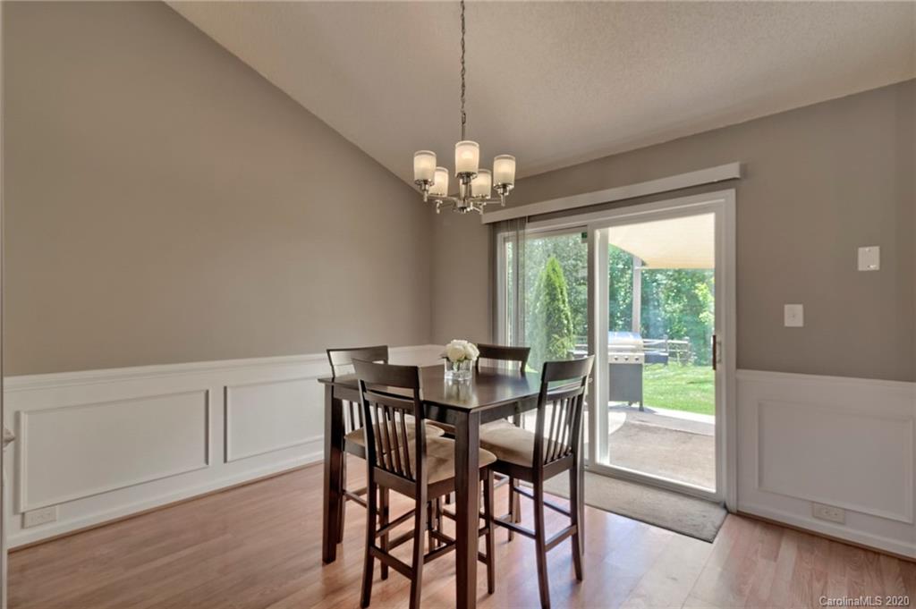 13314 Philip Michael Road Huntersville, NC 28078 - Photo 11 of 39 a view of a dining room with furniture window and wooden floor