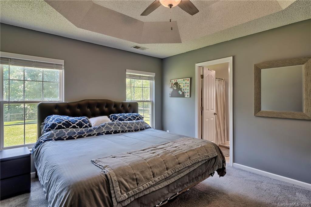 13314 Philip Michael Road Huntersville, NC 28078 - Photo 14 of 39 a bedroom with a bed and a window