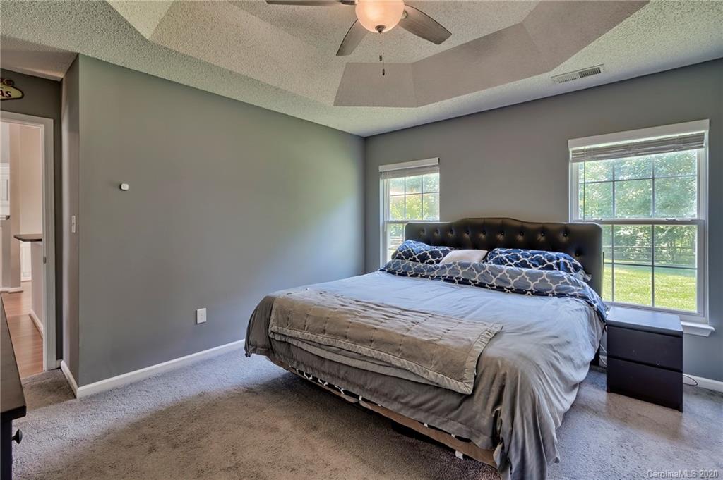 13314 Philip Michael Road Huntersville, NC 28078 - Photo 15 of 39 a bedroom with a bed and window