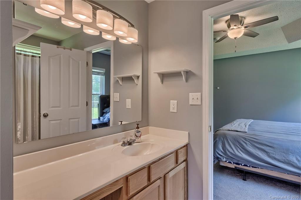 13314 Philip Michael Road Huntersville, NC 28078 - Photo 19 of 39 a en suite bathroom with a double vanity sink and a mirror