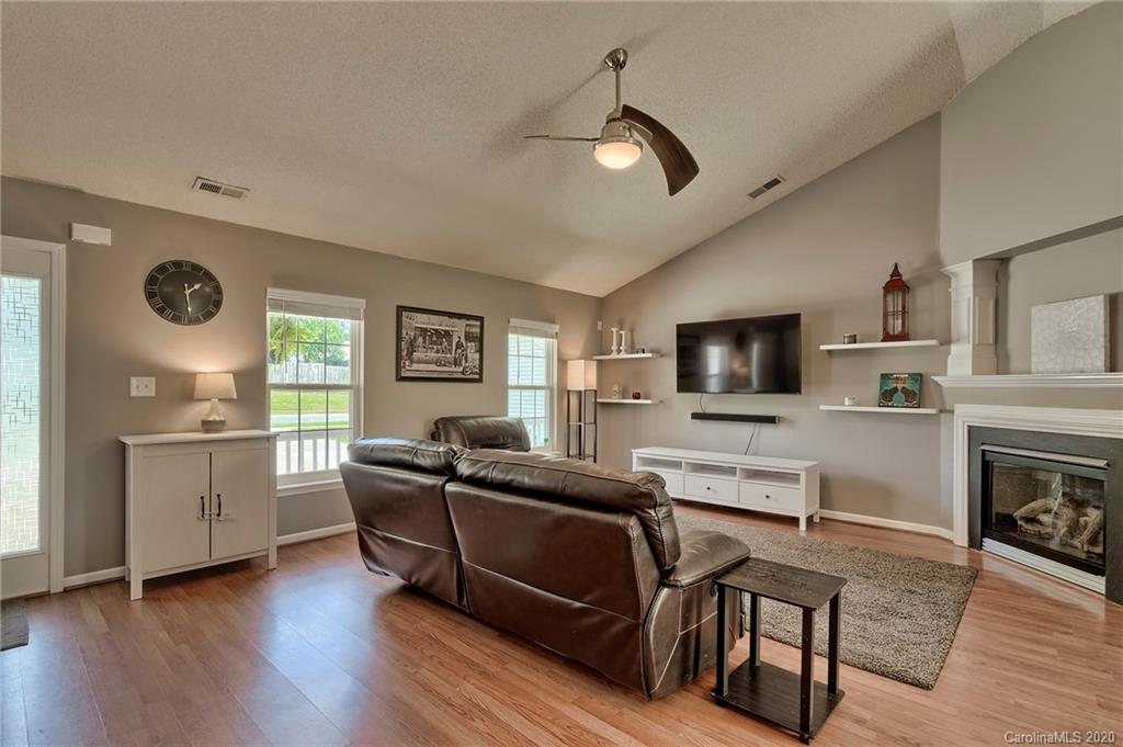 13314 Philip Michael Road Huntersville, NC 28078 - Photo 3 of 39 a living room with furniture and a flat screen tv