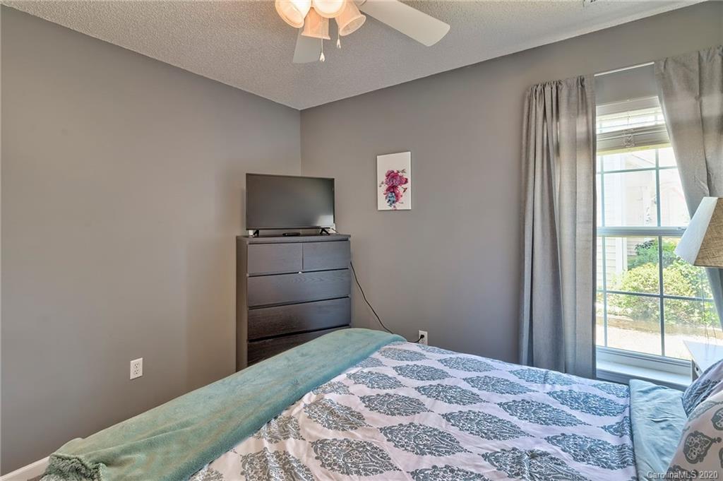 13314 Philip Michael Road Huntersville, NC 28078 - Photo 22 of 39 a bedroom with a bed and a flat screen tv
