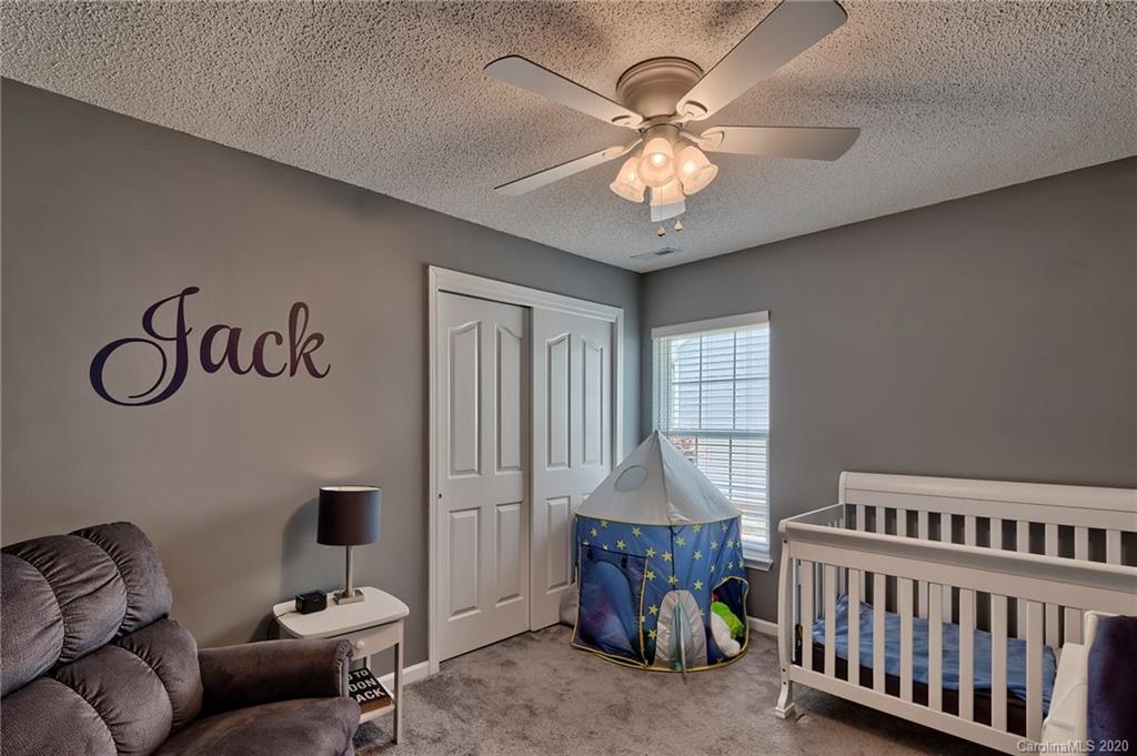 13314 Philip Michael Road Huntersville, NC 28078 - Photo 24 of 39 a bedroom with furniture and a window