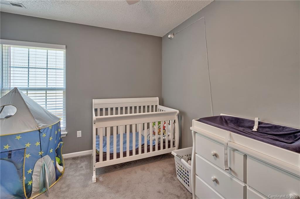 13314 Philip Michael Road Huntersville, NC 28078 - Photo 25 of 39 a bedroom with a bed and a window