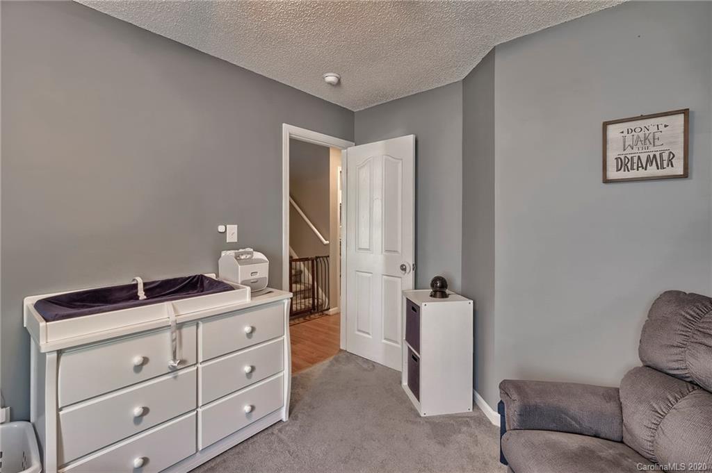 13314 Philip Michael Road Huntersville, NC 28078 - Photo 27 of 39 a bathroom with a granite countertop sink and a mirror