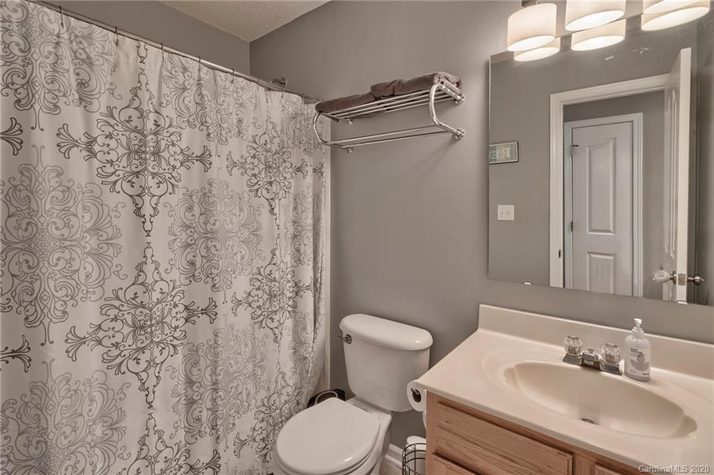 13314 Philip Michael Road Huntersville, NC 28078 - Photo 28 of 39 a bathroom with a sink toilet and shower