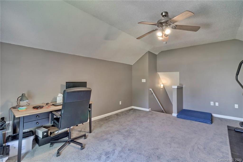 13314 Philip Michael Road Huntersville, NC 28078 - Photo 29 of 39 a view of a workspace with furniture and a chandelier fan