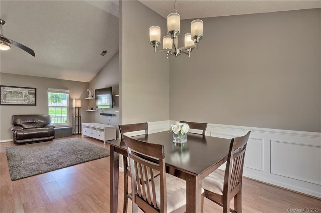 13314 Philip Michael Road Huntersville, NC 28078 - Photo 10 of 39 a view of a dining room with furniture and wooden floor