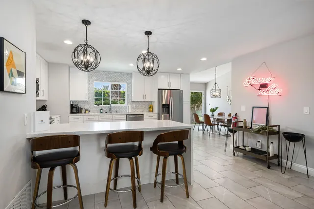 a view of a dining area with furniture window and wooden floor