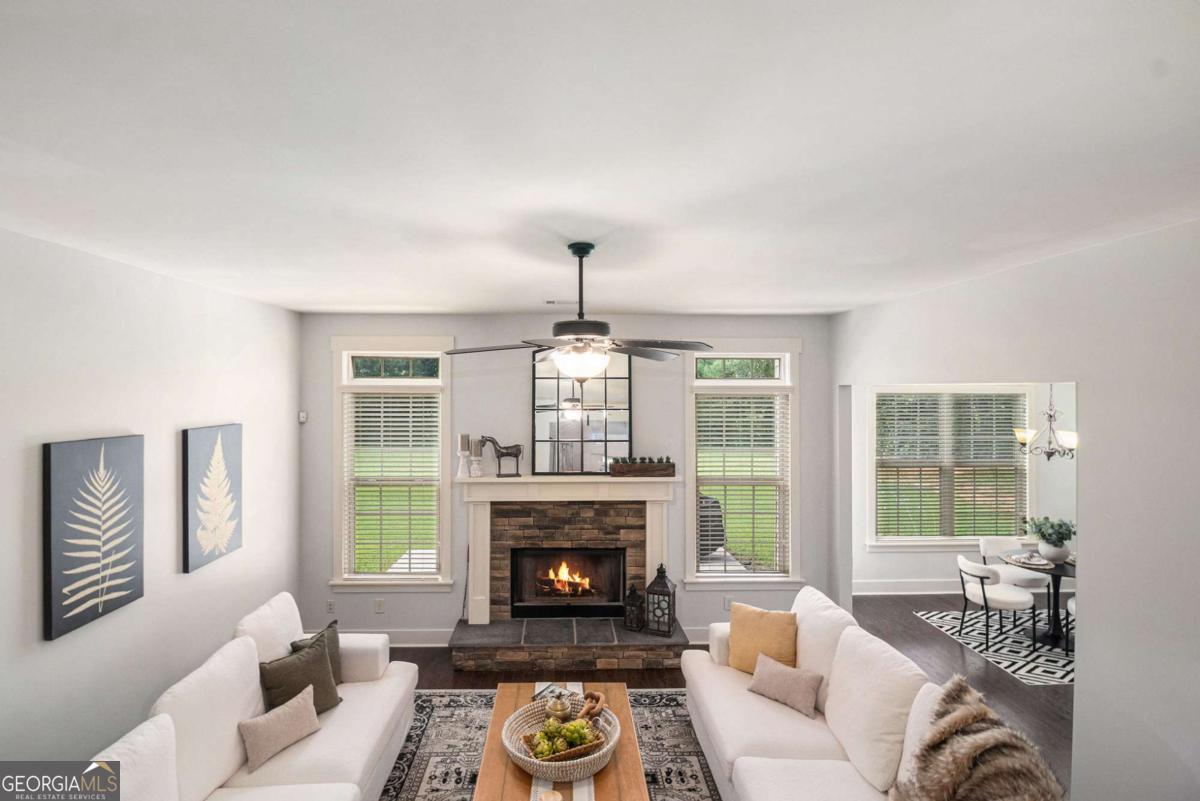 466 Austin Storey Circle Newnan, GA 30263 - Photo 11 of 39 a living room with furniture and a fireplace