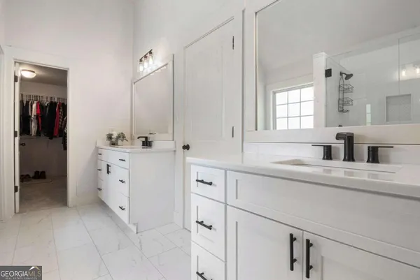 a kitchen with cabinets appliances a sink and a window