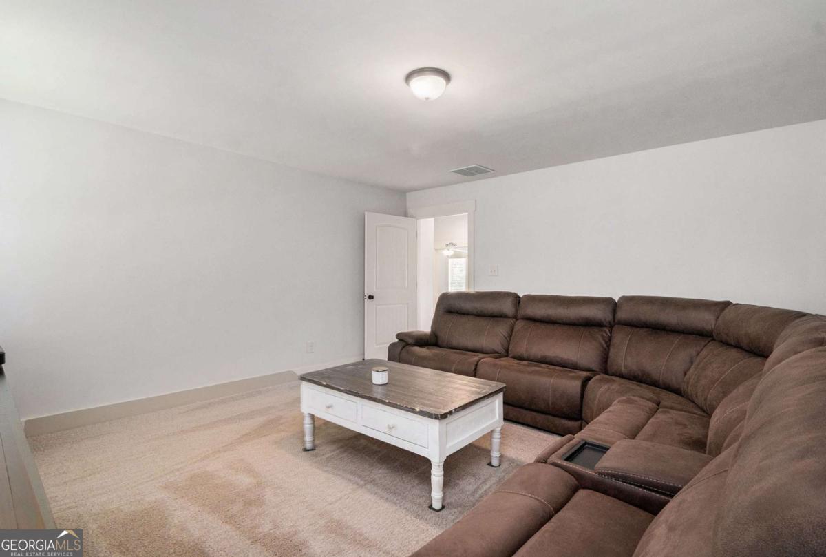 466 Austin Storey Circle Newnan, GA 30263 - Photo 28 of 39 a living room with furniture